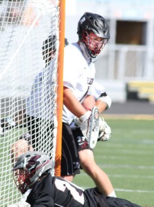 Radnor goalie Alex Andersen makes a stop of a shot over St. Joseph's Prep's Kevin Stump during the Raiders' 11-10 victory in an overtime thriller Saturday at Hersheypark Stadium that gave them the PIAA title. Andersen, who will play football at Penn, made nine saves, several of which could be categorized as huge. (Robert J. Gurecki)